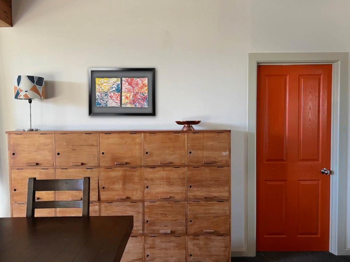 "Let's Paint the Town Red" Shown virtually framed and hung in my dining room. Grey mat. Inktense and oil-stick on pre-treated textural watercolour paper 585 x 325 mm approx. 1 cm gap.